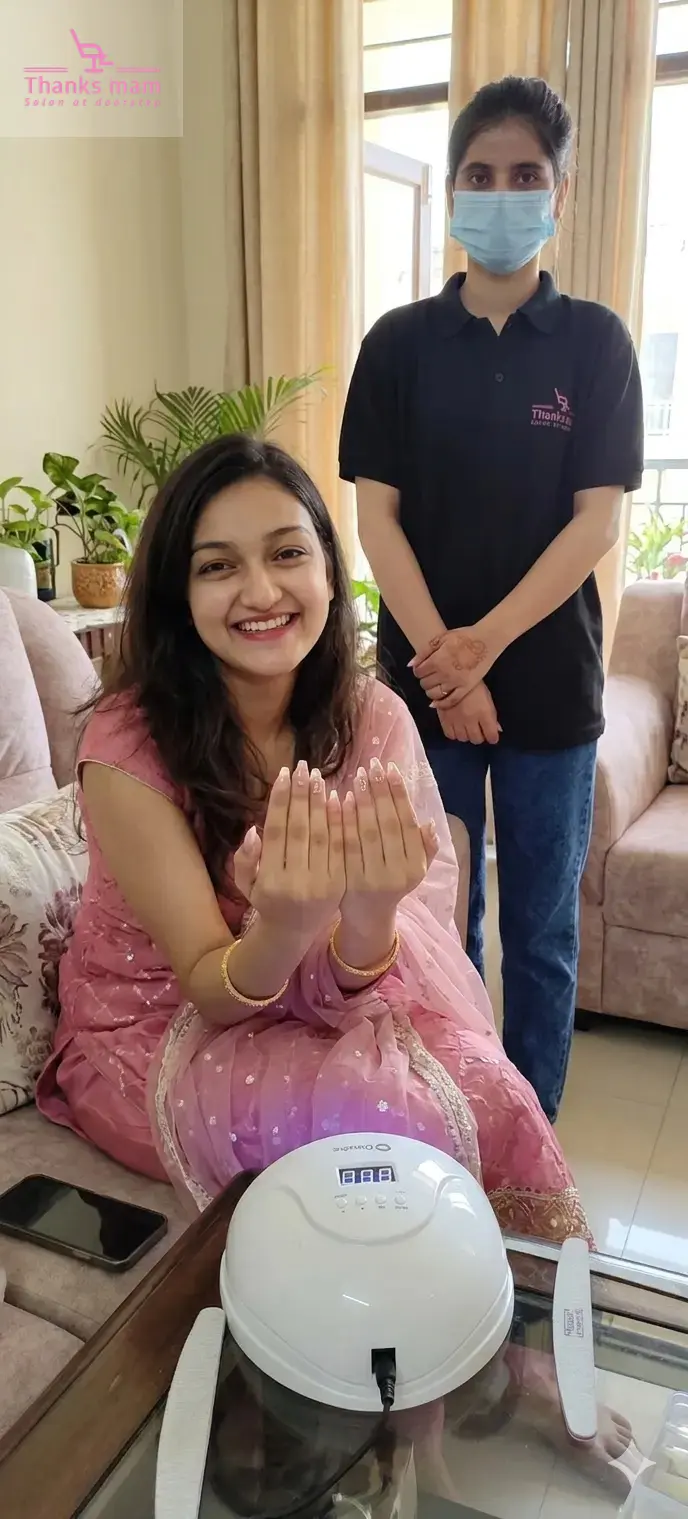 Home salon nail extension service in Gurgaon by ThanksMam with client showing freshly done nails at home